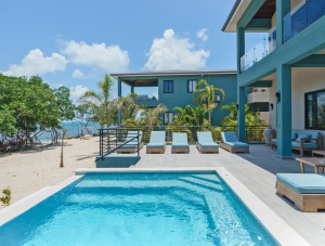 Prana Maya Island Resort view of oceanfront villa pool with second villa in background