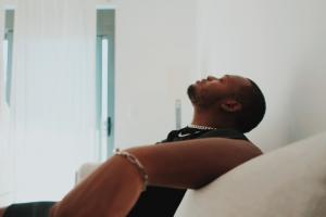 Police officer unwinding after shift, representing stress faced by law enforcement.