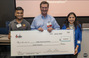 7x24 Exchange DC Chapter Board member Marshall Sorenson poses with leadership from Dulles South Soup Kitchen for a check presentation