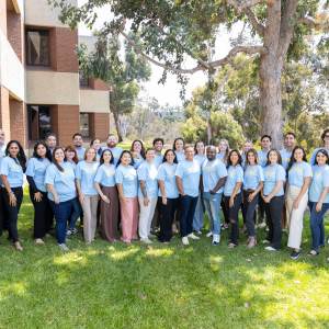 Group photo of Pioneer Healthcare Services team members wearing branded shirts, standing together outdoors, representing the company’s people-first commitment to healthcare and education staffing.