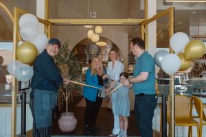 Mayor Holli Thier Cutting the Ribbon with Owner, Betul Kinalilar. Also participating: Betul's husband, Berk Kinalilar, her daughter and Executive Chef Membreno
