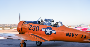 Local cast member filmed beside a vintage aircraft at the Commemorative Air Force Museum in Camarillo during production of the Ventura County Coast commercial