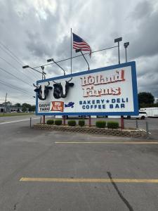 Holland Farms famous billboard sign with Chuckie and Cupcake