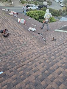 Roof City Inc installing new shingles. Quality roof replacement and repair services