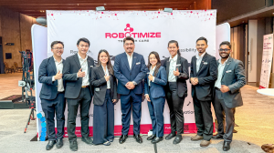 Robotimize team at AOCPRM 2025 in Penang stands by their booth showcasing eight integrated rehab systems from VivantePlexus™ and ACE™—including exoskeletons, FES bikes, and haptic gloves—during live demos.