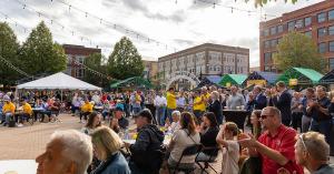 A crowd gathers in Grand Forks town square listening to speakers at the Agristo Community Welcome event on Monday, August 25th.