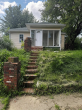 Historic 2-Bedroom home with Brick Archways, Stone Fireplaces, and Wraparound Porch Heads to Auction in Anderson Indiana