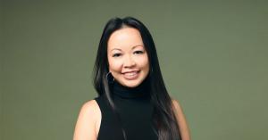Portrait of Amy Yee, Chief Digital Officer at Relevantz, smiling confidently in a business setting.