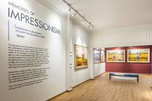 A Hidden Gem in Vietnam’s Art Scene: Discover Réhahn’s Photography Gallery in Saigon 16 Wide-angle shot of the Impressionism-themed gallery room featuring wall text explaining Réhahn’s creative approach, with large framed photographs.