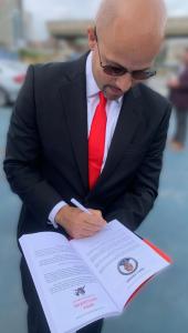 Award-Winning Author Engels J Valenzuela signs copies of Born to Risk during the Philadelphia book launch