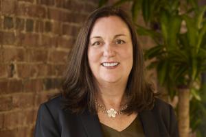 Professional headshot of Nicole Hart, CEO of BackPocket Talent, smiling in a business setting.