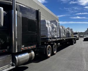 Alvarez Brokerage & Transport LLC truck on the road – freight transport and logistics services