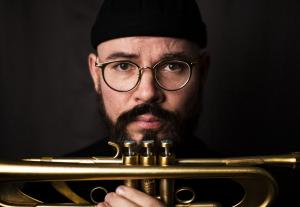 GRAMMY Award–winning trumpeter and composer Charlie Porter will release “Cipher” on Sept Charlie Porter headshot with trumpet (horizontal press photo)