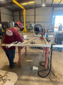 Raw Welding Inc. welder actively working on a metal fabrication project in Bakersfield, California