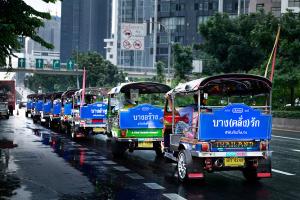 Row of tuk-tuks in Bangkok with blue Durex ads on the back, promoting a local campaign through eye-catching street-level branding.