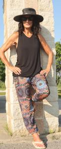 One Woman’s Bold Leap from Minnesota Roots to Launching a Completely Different Style of Clothing Sweeping the Nation "YOGAZ pants in a colorful mandala print, featuring intricate circular patterns in vibrant tones, designed with a relaxed fit, tummy-control front, and wide cuffs for comfort and versatility."