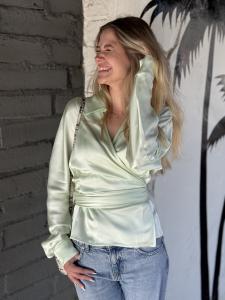 This silky blouse in a beautiful statement mint green color is perfect for a casual day in the park, turning heads in the office, or impressing on a first date. Dress it up or dress it down.