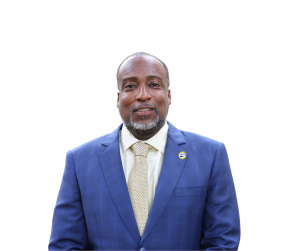 Male in blue suit wearing a WAPA lapel pin on jacket