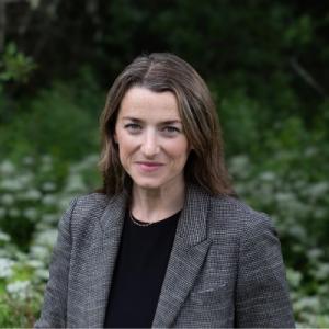 Headshot style image of a women in professional attire