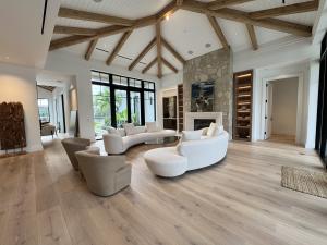 From entryway to living room, wide plank marine-grade hardwood establishes a foundation of luxury in this Palm Beach estate.