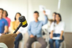 Back view of fighting bidder showing bidding offer number sign.