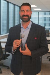 CEO Jereme Dozier Receiving Award