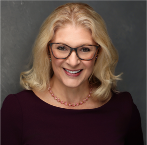 Katie Augustine, founder of ECS Evolve Consulting Services, announcing the launch of the Be The Change™ program for conscious nonprofit leadership.
