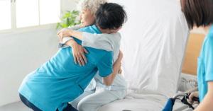 Elderly person being lifted safely with a patient transfer chair for home use