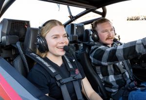 PCI Race Radios is proud to introduce the PCI Vibe Headset — a headset built for today’s UTV drivers, passengers, and off-road explorers who want more than just communication Two people in a UTV wearing their headsets for off road communication