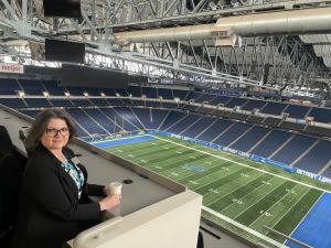 STACK Cybersecurity can accept GI Bill® benefits for our registered apprenticeship program Tracey Birkenhauer sitting in the press area of Ford Field, home of the Detroit Lions