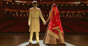 Bride and groom holding hands under a spotlight on  Chicago's iconic Lyric opera stage, cinematic Chicago wedding photography by Jeremy Glickstein