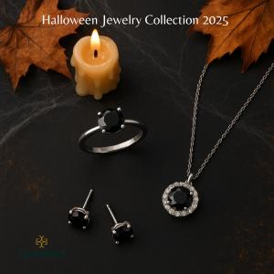 Round black lab grown diamond solitaire ring, black lab grown diamond halo pendant necklace, and black lab grown diamond stud earrings on a black surface with cobwebs, autumn leaves, and a candle. Matching lab grown black diamond jewelry set from the Gemo