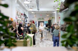 An annual tradition, the Luxury Exchange PDX hosts a trunk show to benefit Ronald McDonald House Charities. The image is from 2024's event, looking at a full view of the store with customers and employees enjoying shopping for a cause.