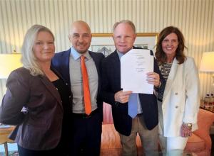 Co-Founder Jamie Prickett, Co-Founder Lee-Ann Prickett with Lisa Holm and Monte Holm, CEO (AOG) Pictured after signing agreement.