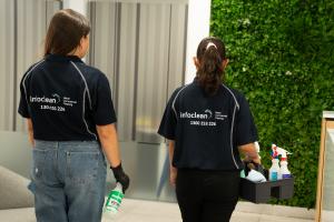 An Infoclean technician's shirt for Sydney office cleaning services, displaying the company name and phone number 1300 253 226.