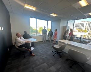 Photo of Aurex team members in new office space.