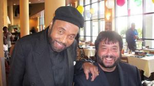 Andraé Crouch and Wolfgang Hildebrandt are shown together smiling