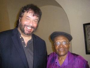 Wolfgang Hildebrandt is shown smiling with Archbishop Desmond Tutu