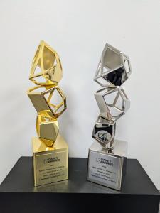 Secret Weapon Media Agency, an award-winning advertising firm based in Madison, Alabama, has announced the launch of its Tactical Battle Plan®, a proprietary product designed to provide family-owned businesses with a custom marketing plan backed by research, analytics, and decades of industry experience Two Davey Award trophies displayed on a black surface against a white background. The gold trophy on the left is engraved with “Secret Weapon Media Agency – We Help Clients Grow,” while the silver trophy on the right is engraved with “Bankston Motor Homes