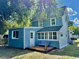 4 BR/2 BA home on .16 +/- acre town lot in the Town of Colonial Beach, VA--nestled between Monroe Bay &. The Potomac River. The home has one bedroom & one bathroom on the main level, 3 bedrooms & one bathroom on the upper level, and features a kitchen w/breakfast nook
