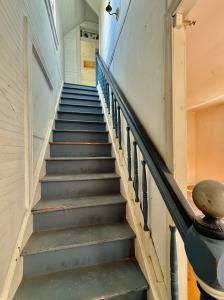 4 BR/2 BA home on .16 +/- acre town lot in the Town of Colonial Beach, VA--nestled between Monroe Bay &. The Potomac River. The home has one bedroom & one bathroom on the main level, 3 bedrooms & one bathroom on the upper level, and features a kitchen w/breakfast nook