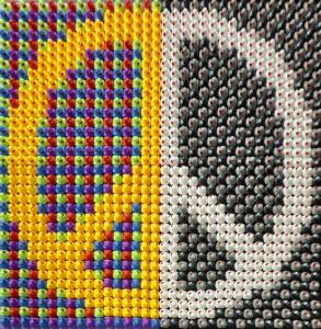 ixed media artwork by Facundo Yebne titled Peace Many Shades One Message showing the transition between black white and color symbolizing unity and balance