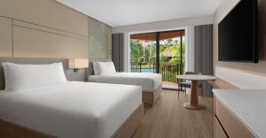 Guest room at Courtyard by Marriott Phuket, Patong Beach Resort with private balcony, terrace, or direct pool access.
