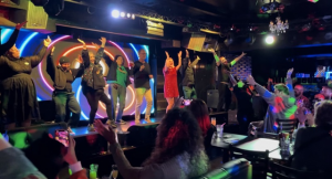 Hamburger Mary’s Las Vegas keeps the spotlight bright with drag, brunch, and comedy all in one place Audience and drag performers on stage at Hamburger Mary’s Las Vegas during a lively show with bright lights and crowd applause.