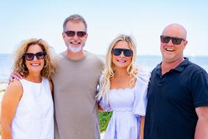 Sarah Hampel with her husband Damien and Prosperity Of Life co-founders Shane and Rachel Krider, highlighting connection, leadership, and global entrepreneurship.