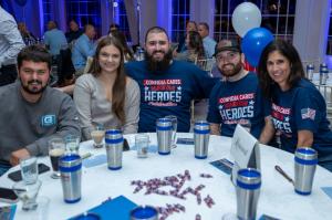 Guests share smiles and conversation at the Confidia Cares: Honor Our Heroes Celebration honoring local first responders.