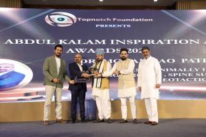 Dr. Mohana Rao Patibandla receiving the Best Minimally Invasive Neurosurgeon, Spine Surgeon, and Stereotactic Neurosurgeon award at the Abdul Kalam Inspiration Awards 2025 in New Delhi.