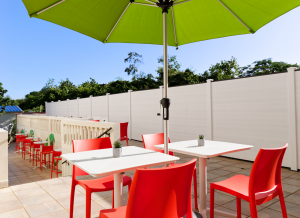 outdoor patio with tables and chairs