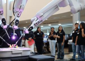 TIF student with PRHS robot