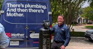 Mother installs home water softener in Preston Hollow, TX.